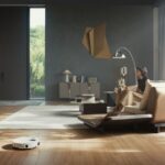 Minimalist living room with a woman, dog, and floor-cleaning robot